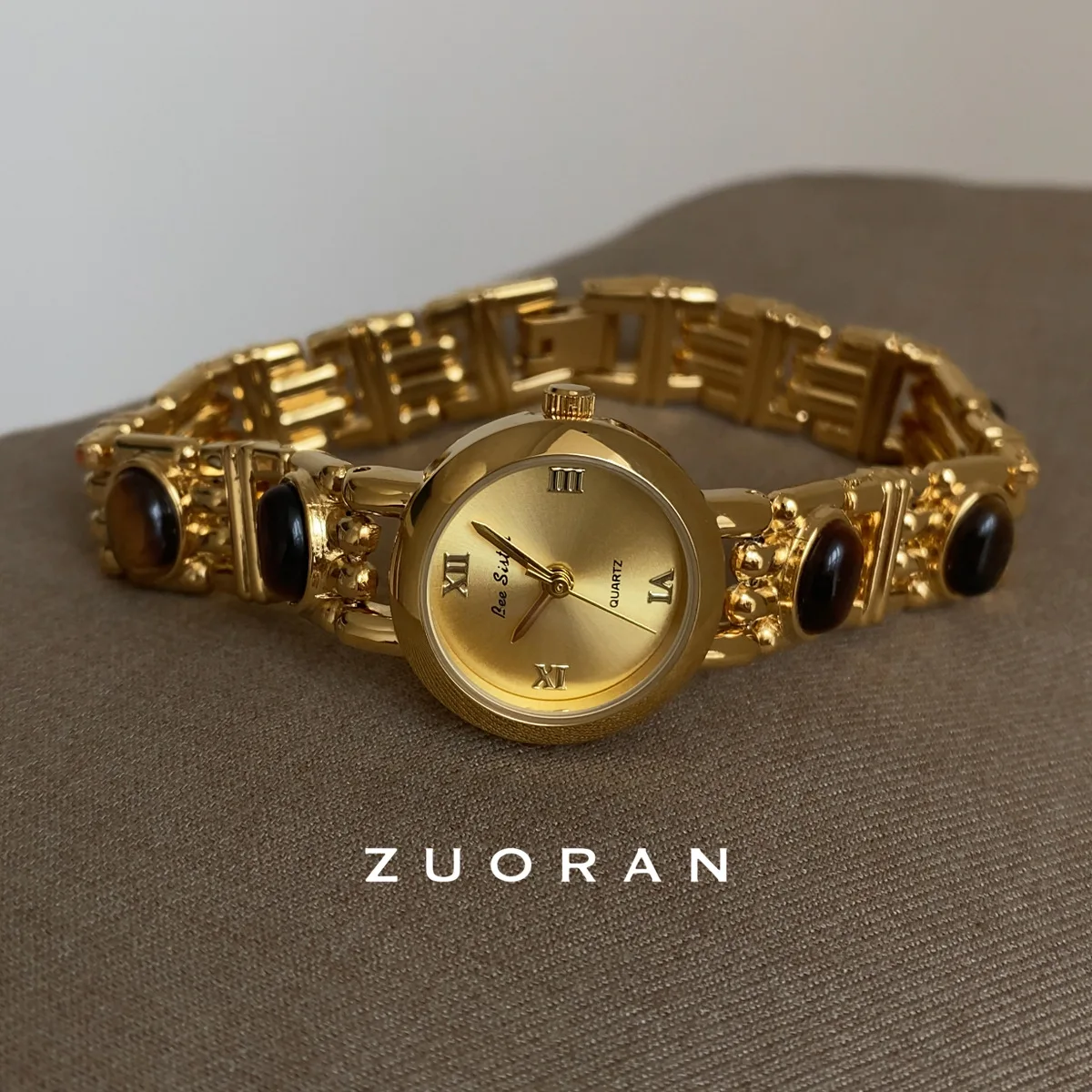 Vintage-inspired, sophisticated gold-tone quartz watch for women, exuding understated luxury and style. A truly unique timepiece