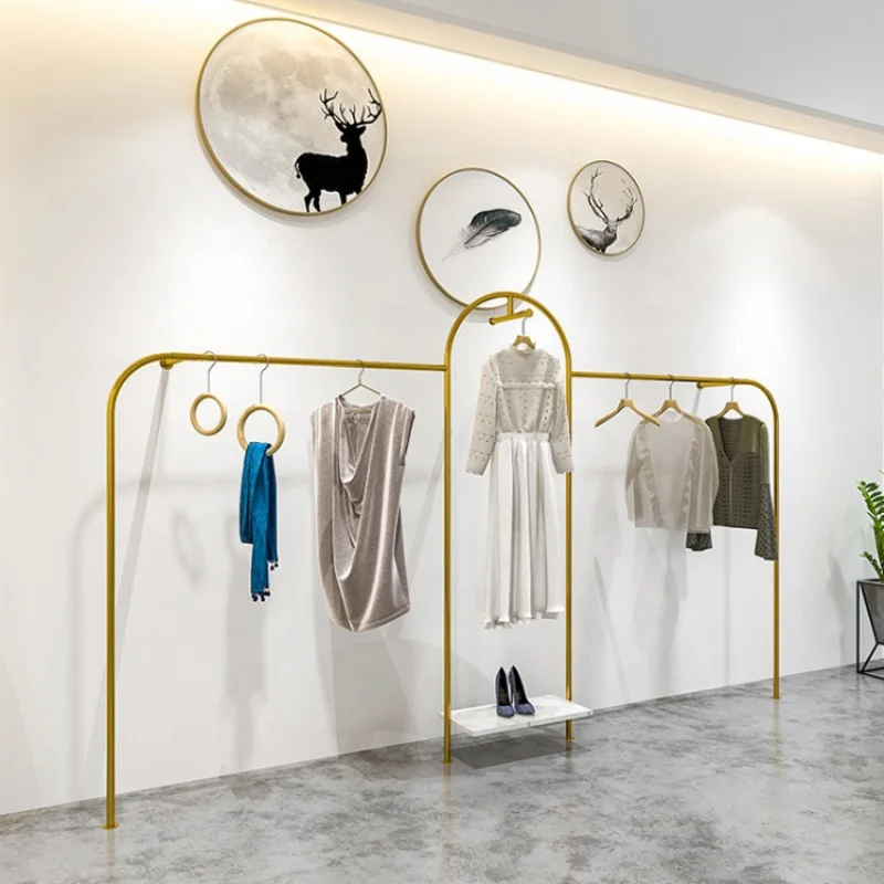 Custom, wall mounted gold metal hanging rack for clothing store showroom display stand furniture