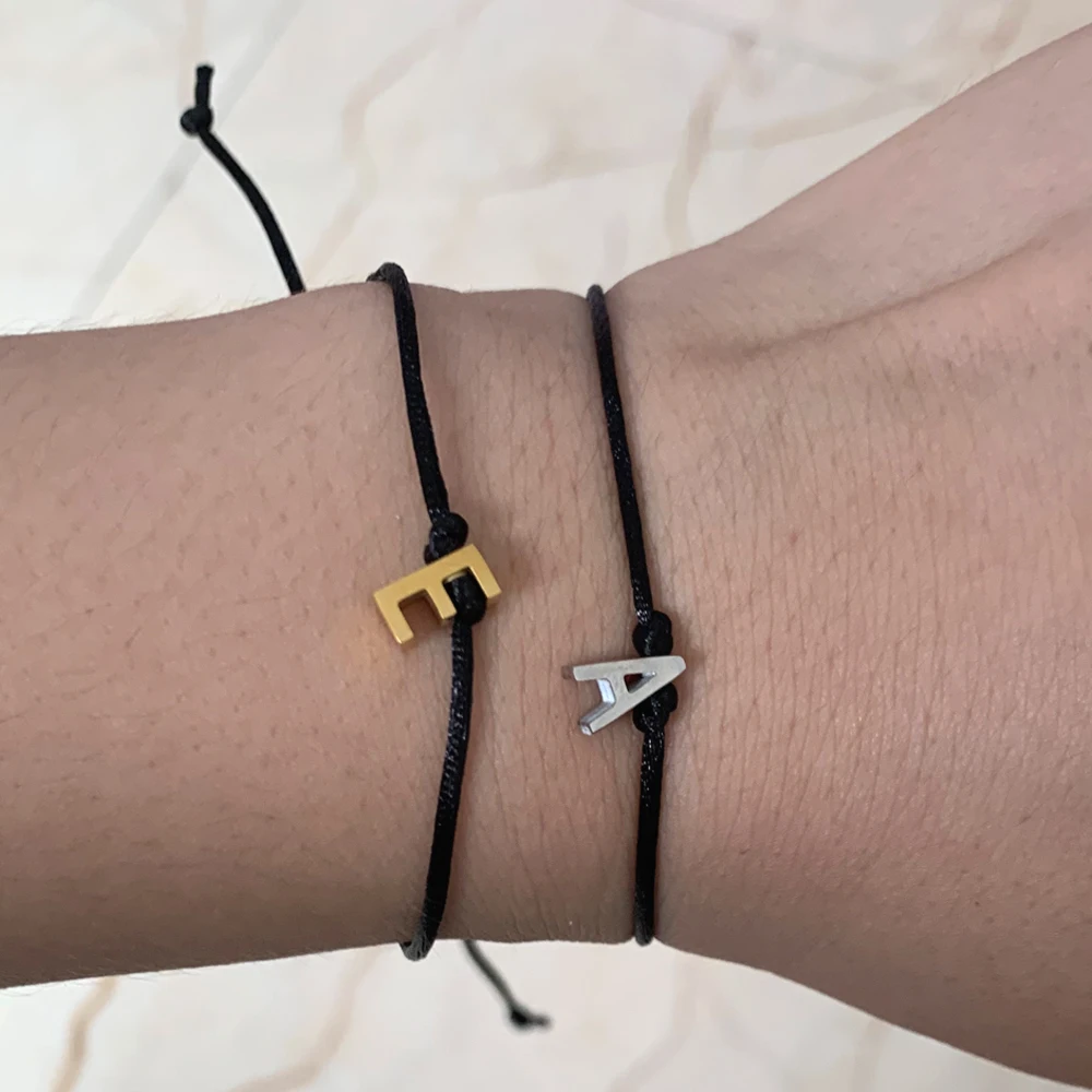 Pulsera hecha a mano con letras de acero de Color dorado y cuerda negra, pulsera informal elástica para mujer y hombre, brazalete para brazo con hilo