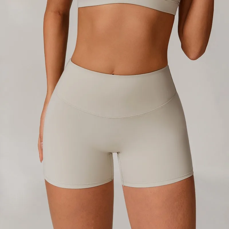 Pantaloncini da yoga transfrontalieri a vita alta e sollevamento dei fianchi indossati su pantaloncini sportivi attillati, dimagranti e da corsa per un look femminile
