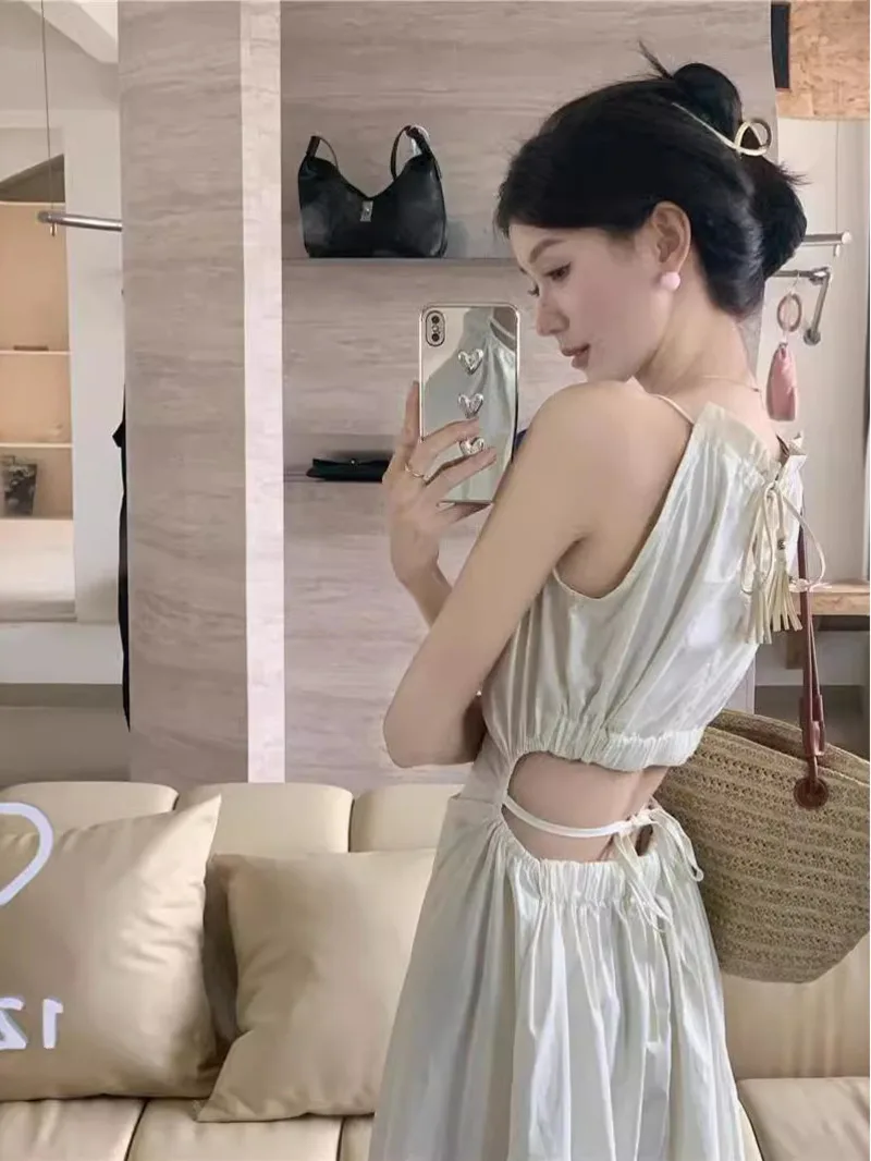 

Hanging neck and strap dress for summer design hollowed out waist slimming temperament seaside beach vacation long dress O4I9