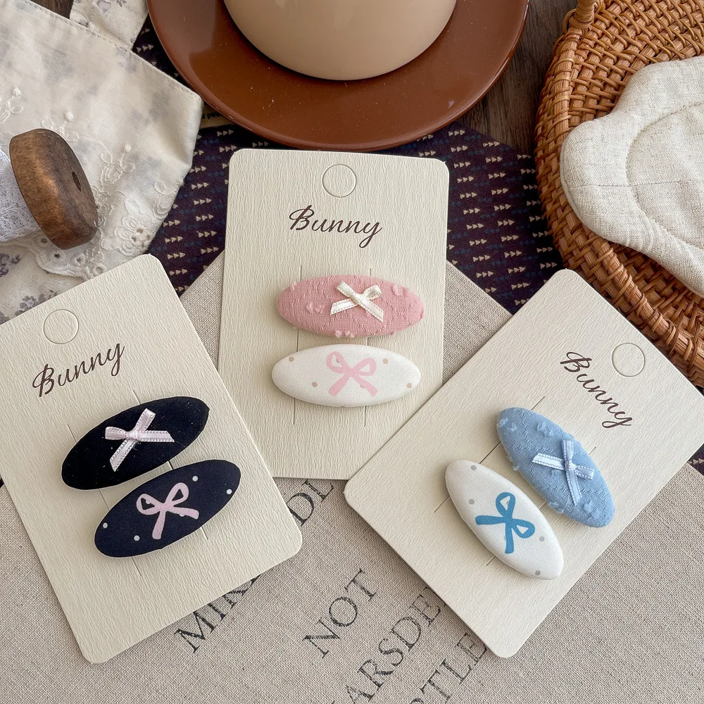 

Заколка-бантик в корейском стиле, овальная, маленькая и свежая, универсальная для девочек, милая модная заколка для волос, для укладки челки и прядей.