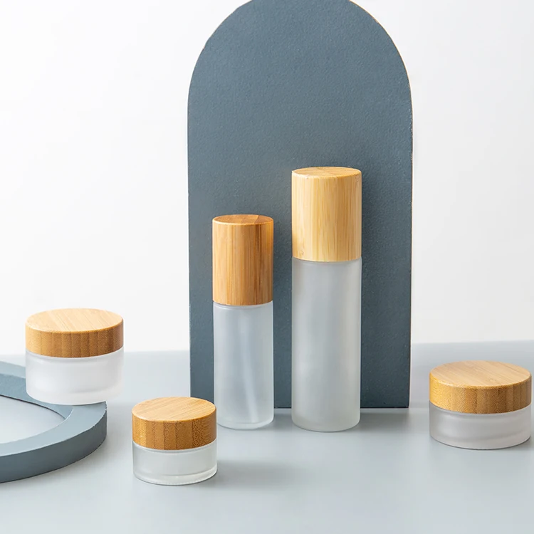 Luxury Cosmetics Packaging Glass Bottle Sets Bamboo Lid Cream Jar and Pump Spray Bottle Set Skincare Face Cream Lotion Bottle