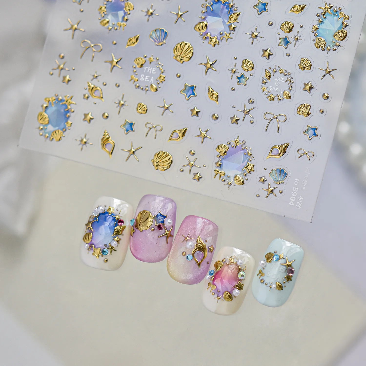 Glamouröse Marine-Nagelaufkleber 5D Regenbogen-Goldfolie Ozean-Edelstein Muschel Seestern Schnecke Schleife Blumenrahmen Nagelkunst-Sticker Maniküre-Dekoration
