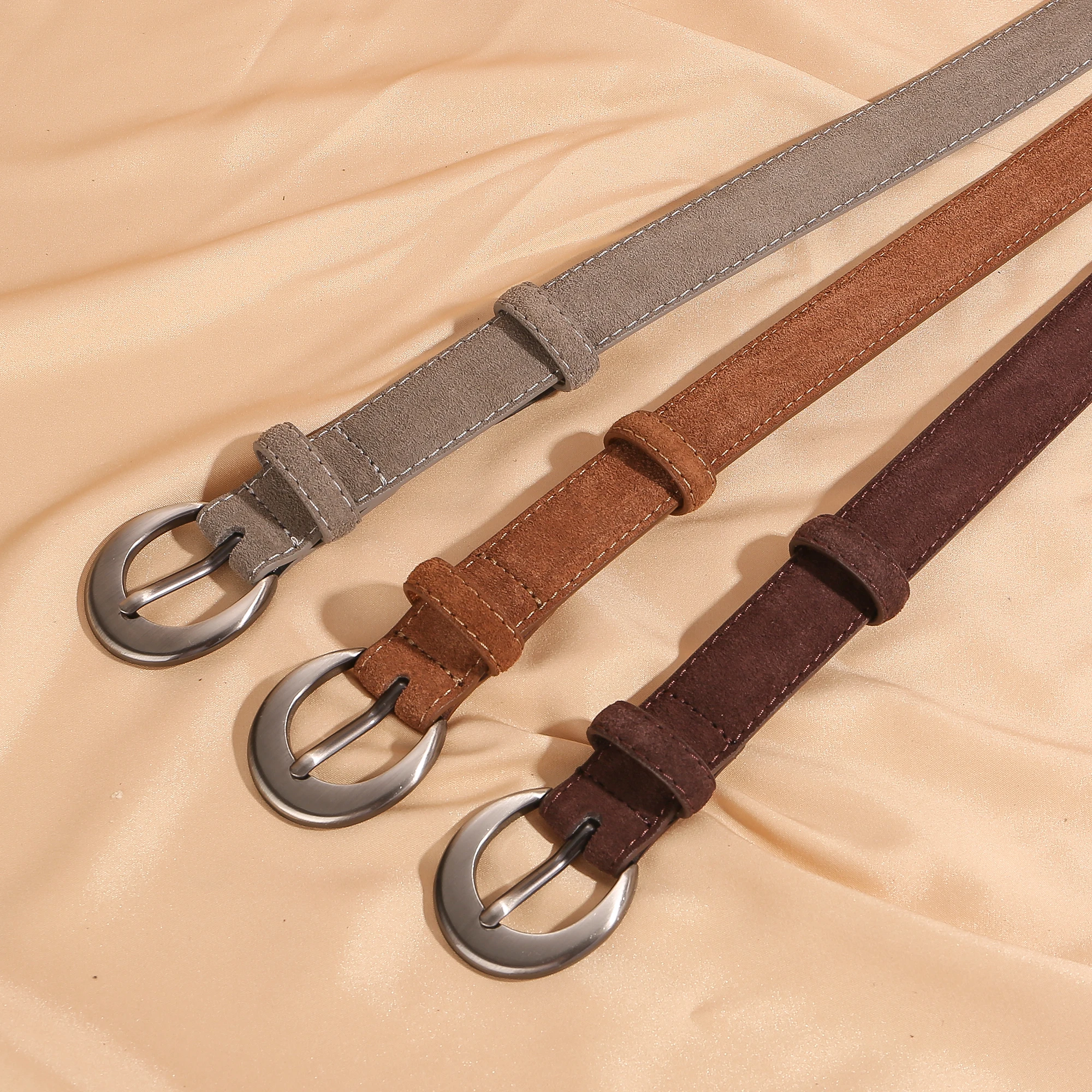 Stylish women's suede leather belt crafted from double-layer cowhide with a designer silver buckle. Available in multiple colors