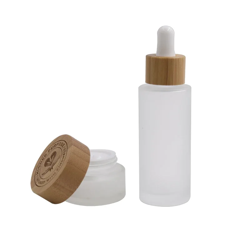 

sellingluxury empty cosmetic eye cream glass jar with bamboo cap，frosted clear face cream cosmetic container jar withbamboo cap