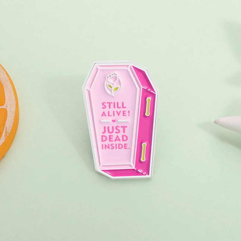 

Pink Coffin Enamel Pin Still Alive Just Dead Inside Portal Game Satirical Quote Brooch Lapel Badge Jewelry Gift for Friends