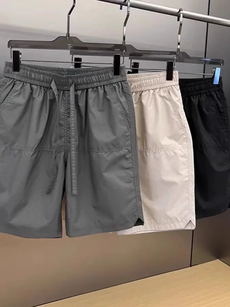 

Новые летние дышащие повседневные мужские брюки с лазерной дрелью, свободные универсальные тонкие спортивные брюки с пятью точками Qui Dry