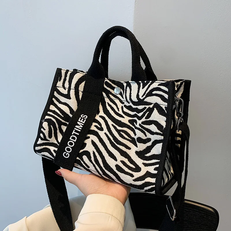 

Original Uoct.all Fashion Female Large capacity handbag Zebra canvas Casual Bag Female Student Shoulder Bag Messenger Bag