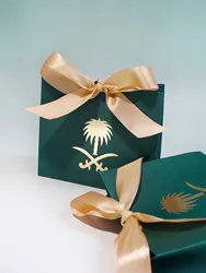 Elegant Dark Green Gift Boxes with Gold Palm Emblem and Satin Ribbons, Perfect for Sophisticated Gifts and Special Occasions