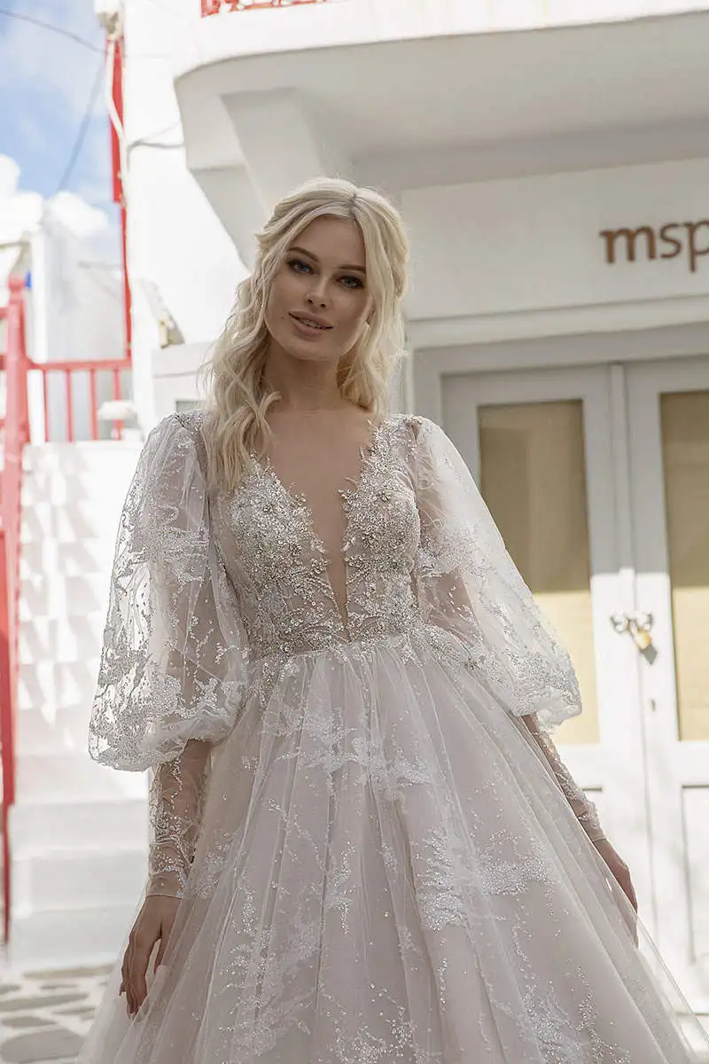 Abiti da sposa eleganti a linea A maniche lunghe Perline Paillettes Appliques Abiti da sposa in pizzo con bottoni personalizzati sul retro