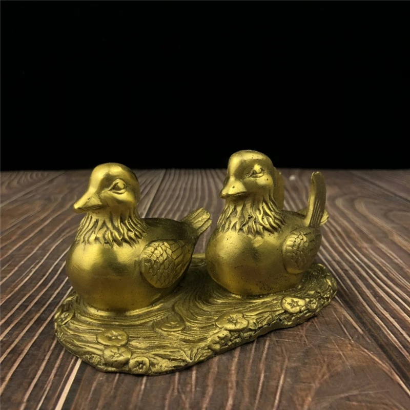A pair of brass mandarin duck ornaments, decorative wedding gift