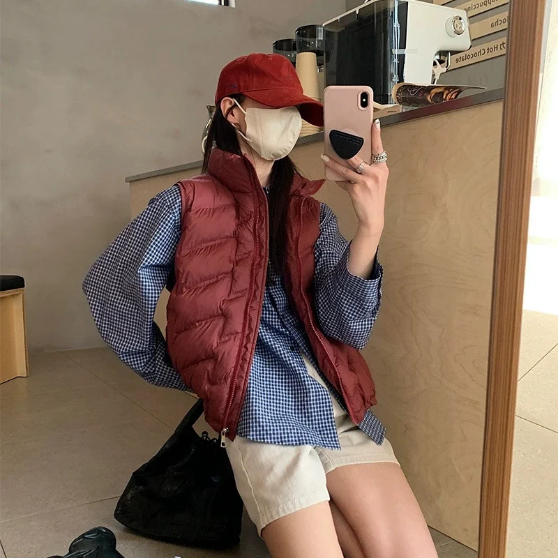 Women Fashion Autumn New 2025 Stand Collar Elegant Down Coats Warm Outerwear Casual Belt Sleeveless Winter Women Vests Jackets