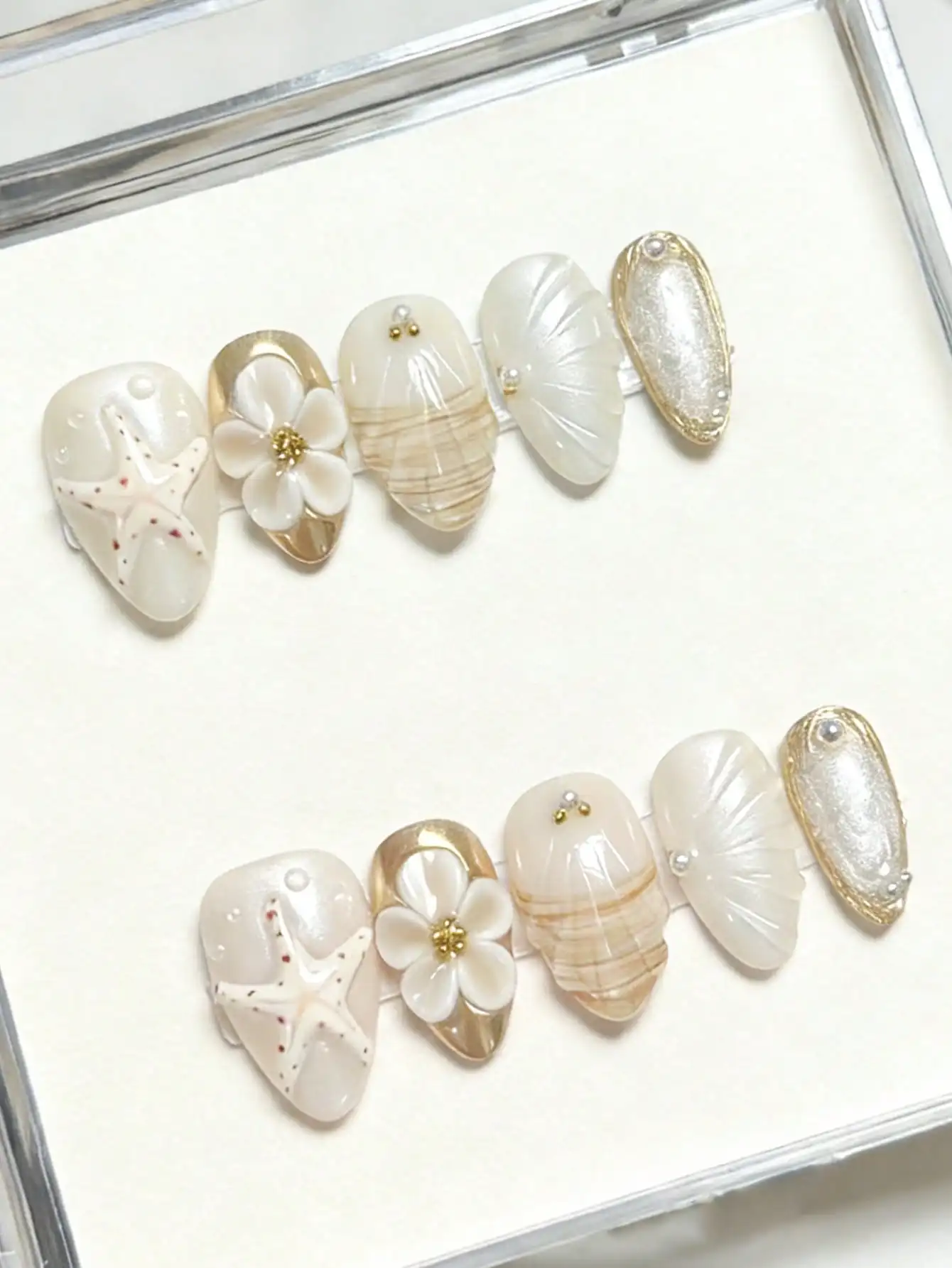

10pcs Minimalist Elegant INS Daily Versatile Gold Framed Hand-Painted Golden Glitter 3D Embossed Starfish Flower Water Drop Almond Nail Art Stickers, White & Gold Tones Nails Nail Supplies Handmade Press On Nails