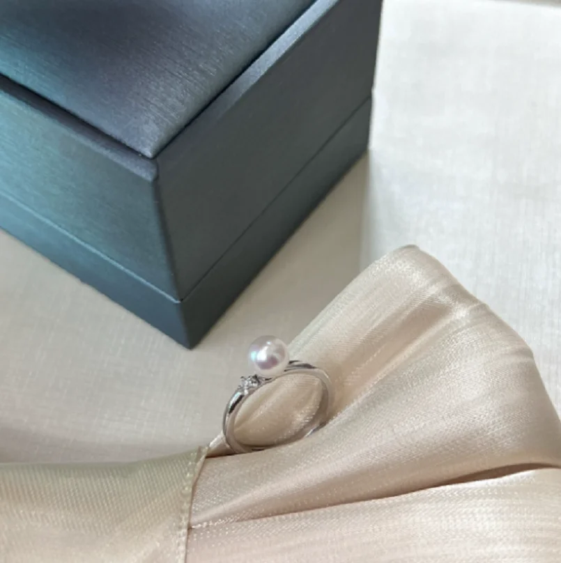

Wholesale brand new AAAA 9-8mm natural Nanhai white rivet pearl ring 925S.