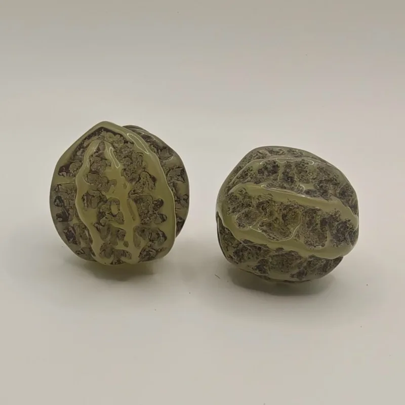 Antique miscellaneous handpieces, vintage synthetic luminous stone walnuts, a pair of craft items for handling
