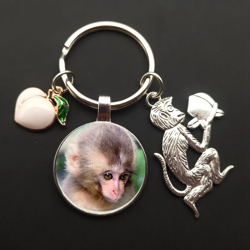 Monkey charm keychain monkey painted glass cabochon car bag ornaments peach keychain men and women souvenirs