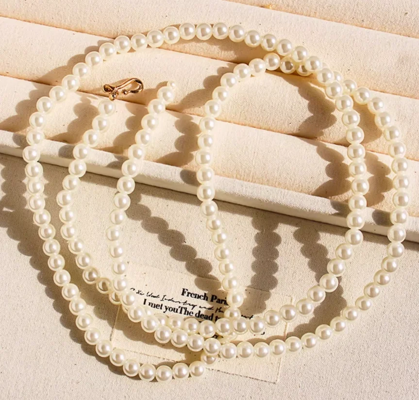 Plusieurs façons de porter ce collier de perles long et élégant de style français ; chaîne de pull multicouche à la mode ; bijoux d'exportation.