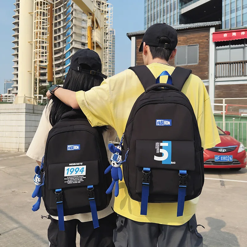 Eine trend ige und coole Schüler-Schult asche, koreanische Version, Brief-Paar-Rucksack mit großer Kapazität, Computer-Rucksack im Freien