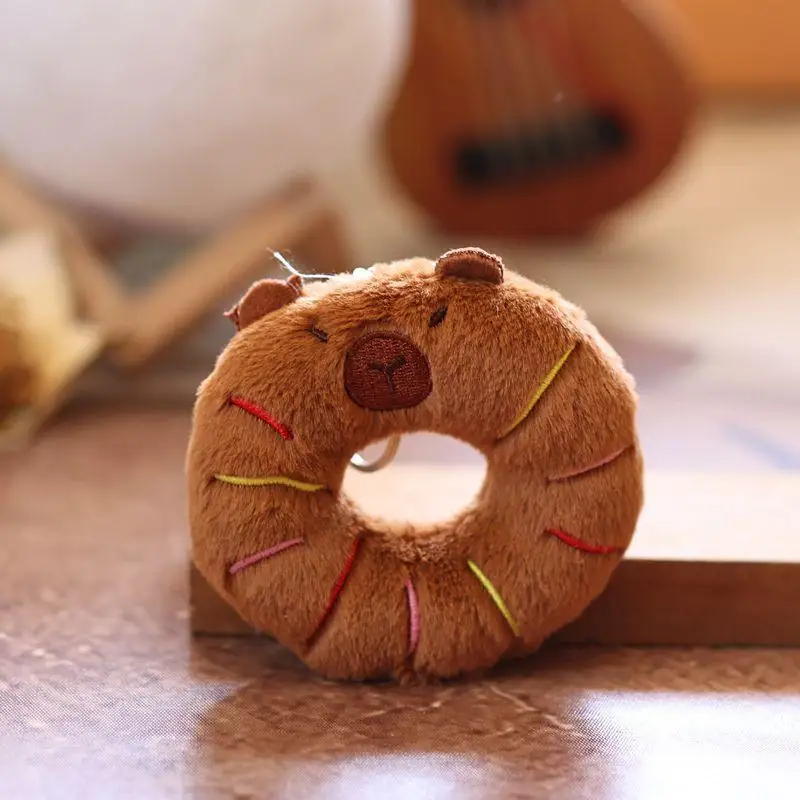 1 ชิ้น Creative Donut ตกแต่งอาหารตุ๊กตาพวงกุญแจการ์ตูน Capybara จี้ Soft Plush ตุ๊กตากระเป๋าอุปกรณ์เสริม