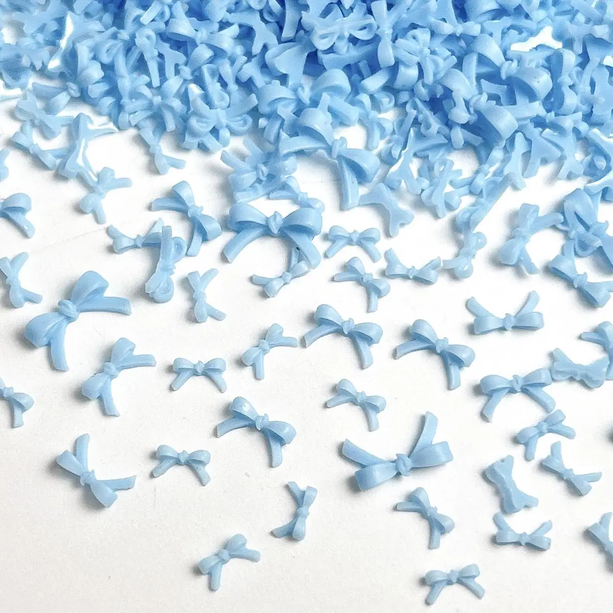 

120PCS 3D Mini Solid Color Bowknots Nail Art Charms Cute Blue Bows Small Fresh Resin Nail Decorations for DIY Manicure Supplies