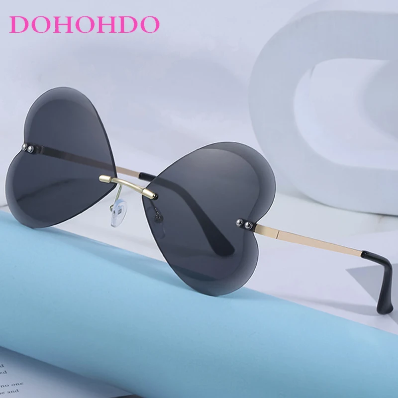 

Popular Metal Rimless Butterfly Women Sunglasses New Luxury Designer Men Eyewear Outdoor Summer Traveling Shades Ladies UV400