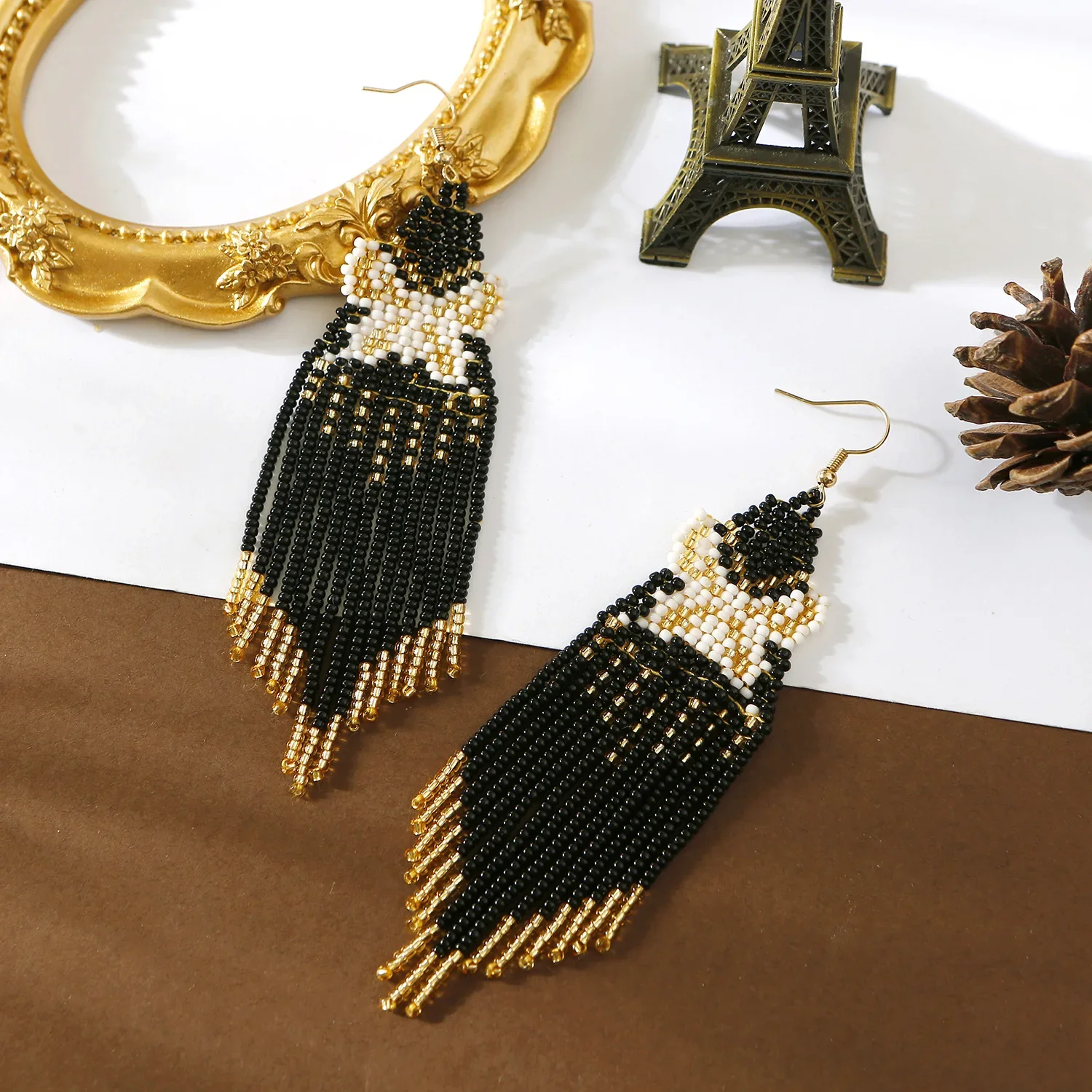 

Beaded earrings Tassel Butterfly Design Originality Hand knitting Bohemia Alloy Tide Female Simple Rice bead earrings