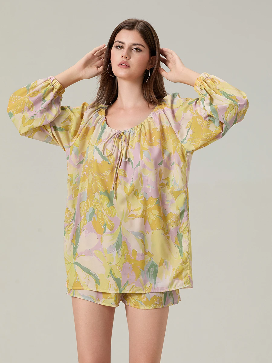 Elegant Floral Ensemble Stylish Long Sleeve Blouse with Tie-up Detail and Elastic Waist Shorts for a Chic Summer Look