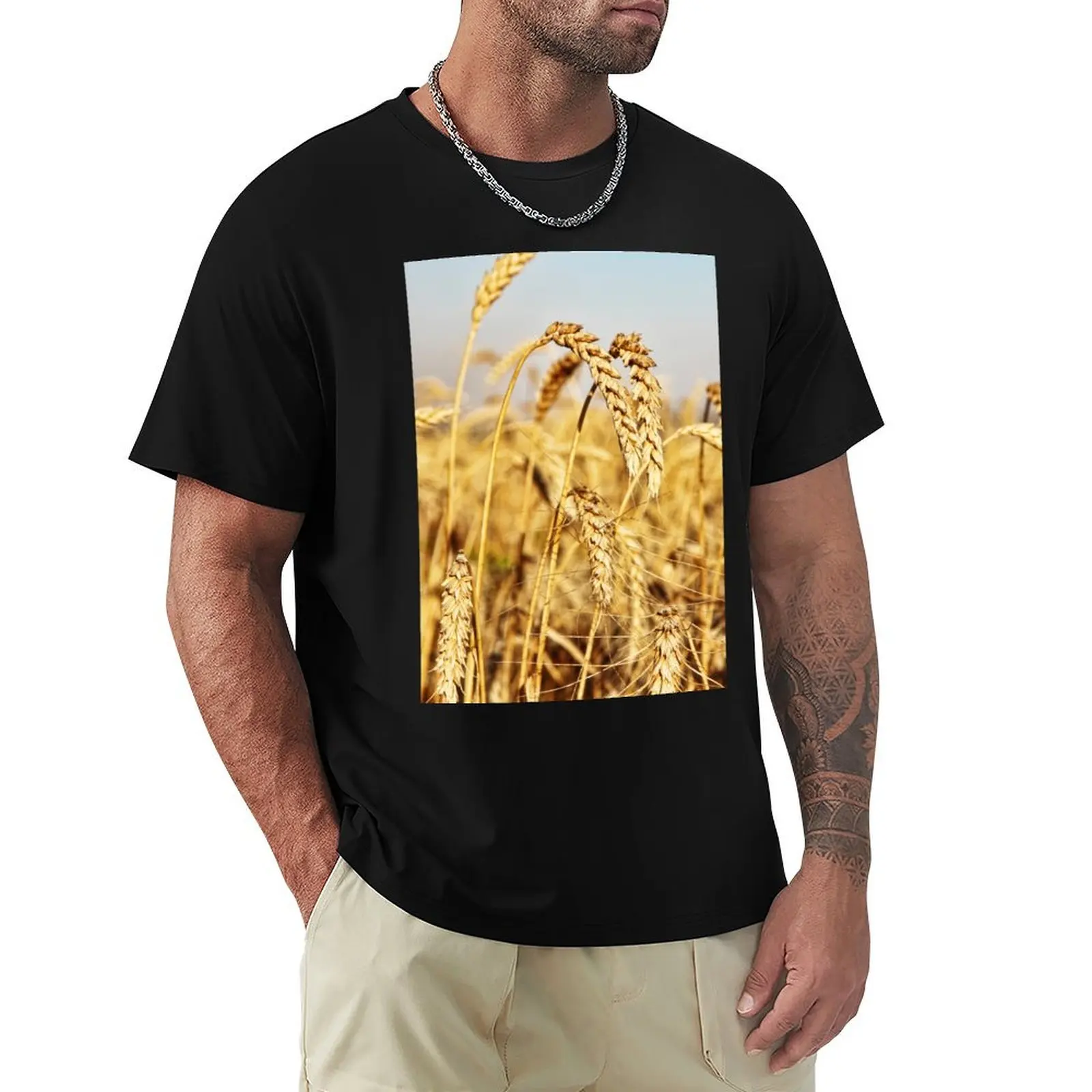 

Ripe wheat ears on field. T-Shirt shirts graphic vintage mens t shirts top quality