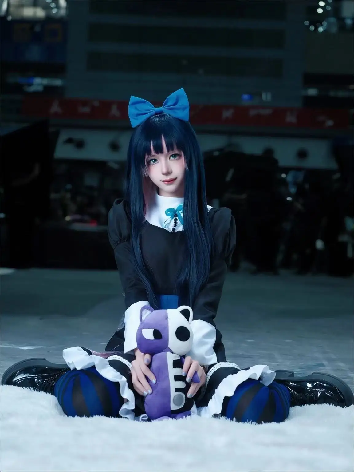 

cosplay anime of the heroines Panty and Stocking from Panty Stocking with Garterbelt in Japanese anime-style maid costumes
