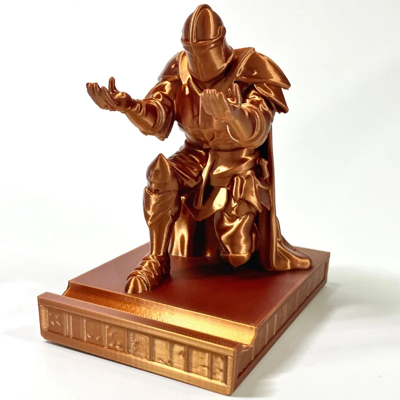 3D printed executive knight pen holder ornament. Office supplies wearing armor heroic knight kneeling and holding the ornament.