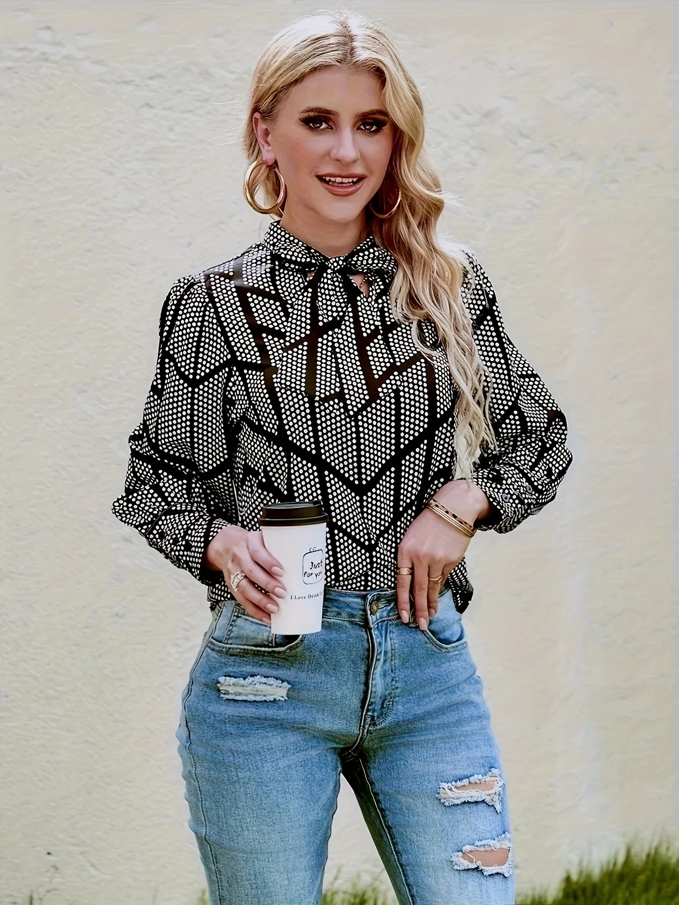 

A women's black and white geometric polka dot lapel bow top fashion personality style slim long-sleeved chiffon shirt