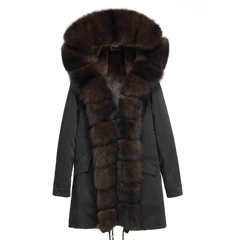 Winter women\'s long parka commuting style waterproof fabric. A combination of natural fox fur collar and rex rabbit fur real fur