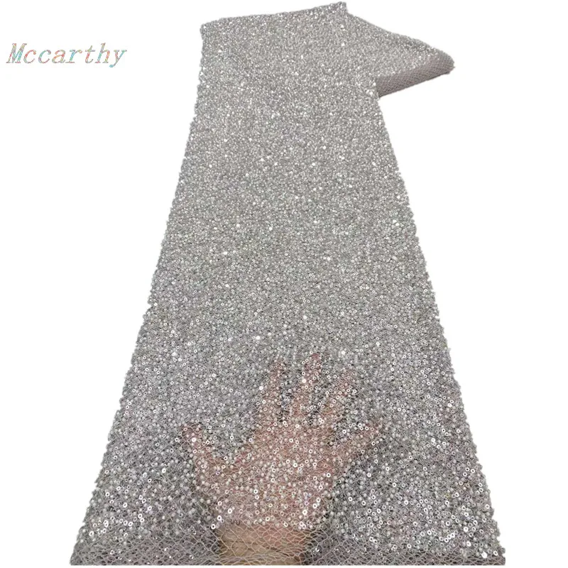 

Высококачественная новая африканская ткань с ручной вышивкой, бисером, сетчатым кружевом и пайетками для создания свадебных или вечерних платьев.