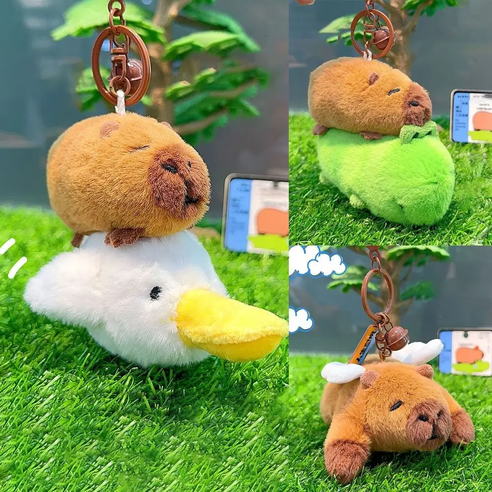 ใหม่ Creative Capybara จี้ตุ๊กตาการ์ตูน Capybara ตุ๊กตาตุ๊กตารถพวงกุญแจแขวนกระเป๋าเป้สะพายหลัง Decor หญิง