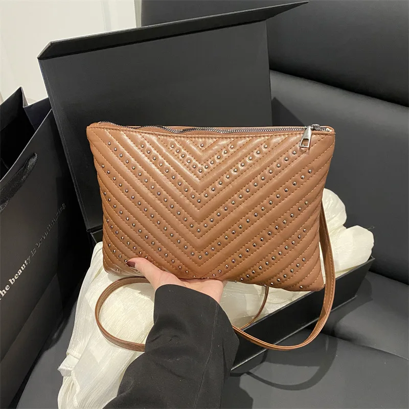 Embossed hot drill solid color stripe large capacity simple lady clutch multi-function shoulder envelope diagonal span bag