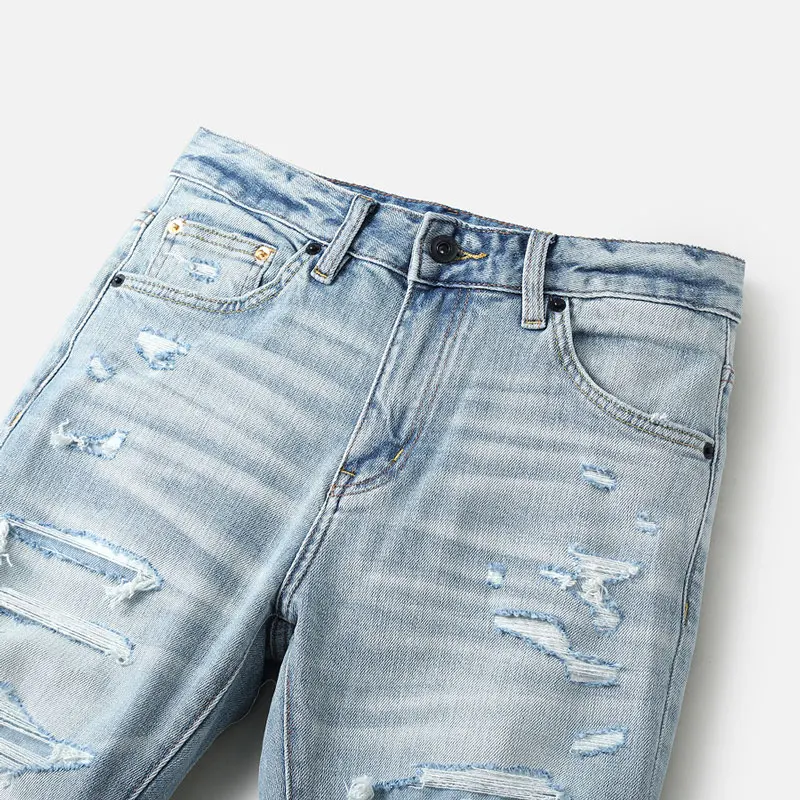 

Israeli designer fashion new light blue men's jeans tear wrinkles nostalgic stretch slim fit retro washed light blue casual pant