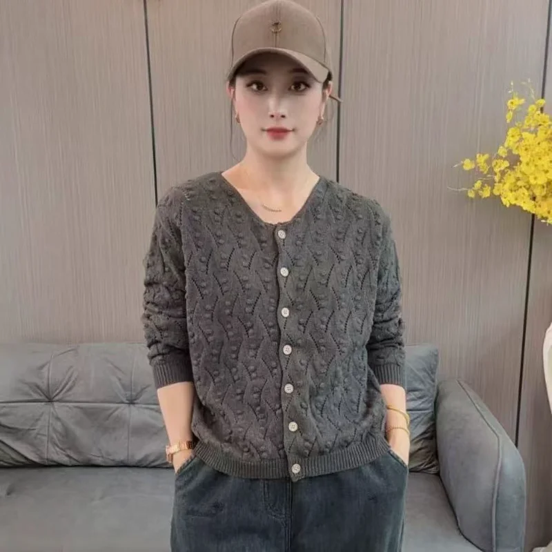 

Autumn and Winter Women's New Stitched Round Neck Button Fashion Solid Color Knitted Jacquard Hollow Sweater Cardigan