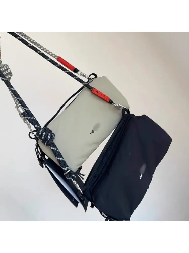 AliExpress NONE Fashionable niche outdoor cycling backpack, ultra lightweight, carrying sports crossbody bag, trendy brand for men