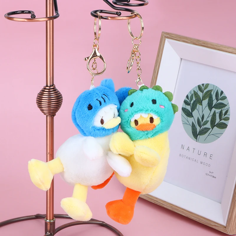 Mochila creativa colgante de bolso de muñeca para niños y niñas, muñeca de moda, nueva serie de pato de cabeza divertida, llavero de coche de juguete de peluche