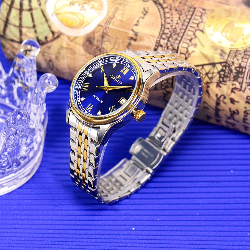 A lady's gold steel strap with a stylish blue dial date automatic mechanical watch