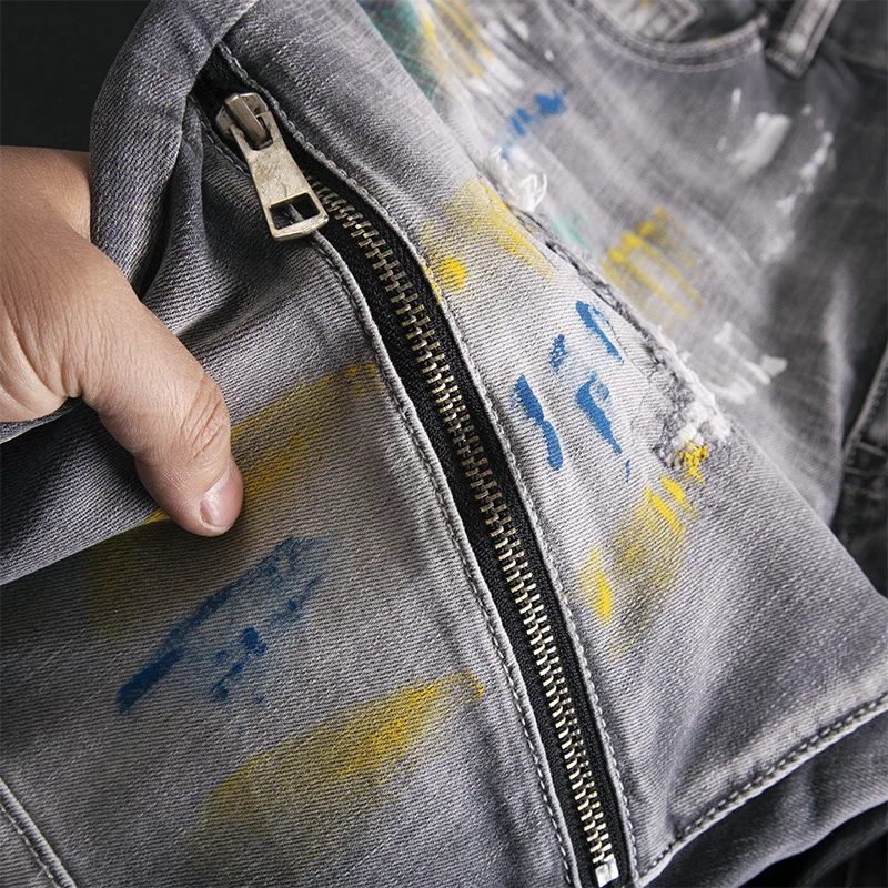 Broken hole patch graffiti splicing jeans for men, slim fit with small feet, elastic retro splashed ink high-end trendy pants
