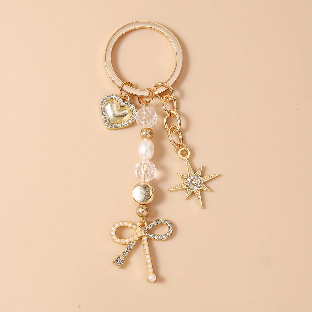 Aihua Exquisiter Schlüsselanhänger in Goldfarbe mit Herz, Stern und Schleife für Damen und Mädchen, Handtaschenanhänger, Dekoration, handgefertigter Schmuck, Geschenke – Detail 2