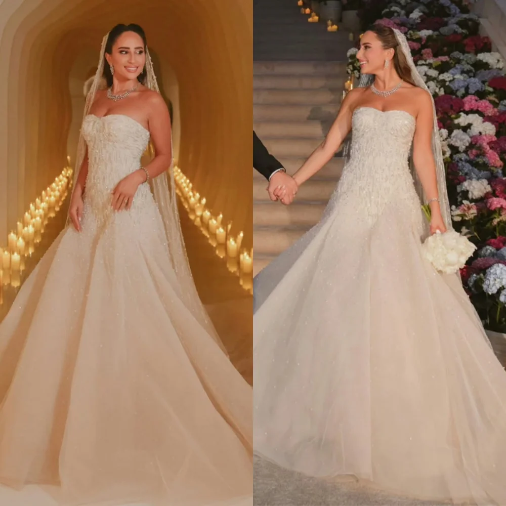 カスタマイズされた絶妙なホワイトチュールブライダルドレスエレガントなストラップレススパンコールのウェディングドレスチャペルトレインオープンバックvestidoデノビア