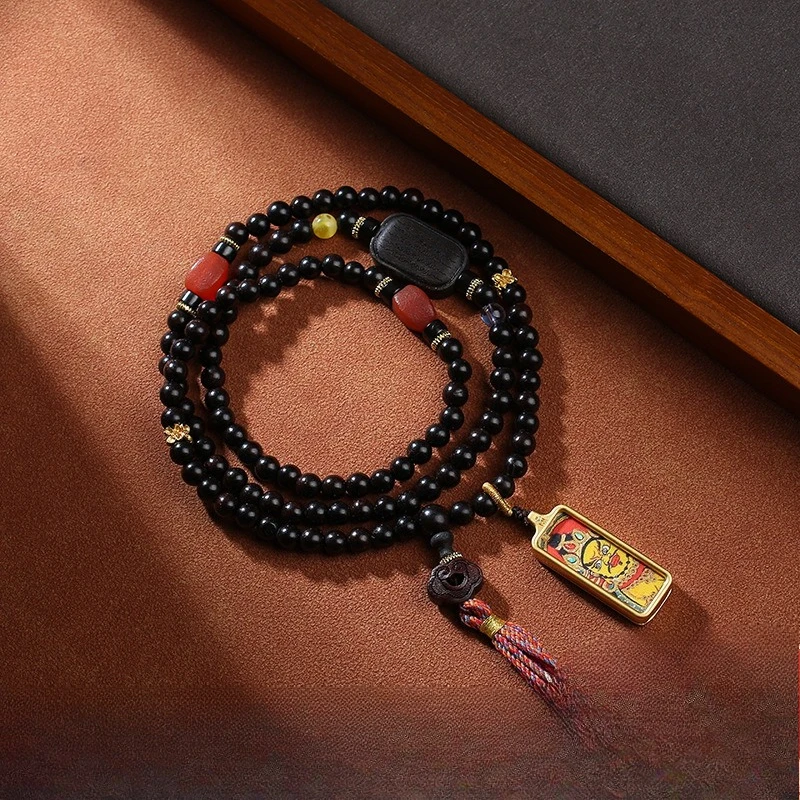 

Tibetan Yellow God of Wealth Tangka Pendant with Handcrafted Ethnic Style Cultural Pendant in Black Sandalwood