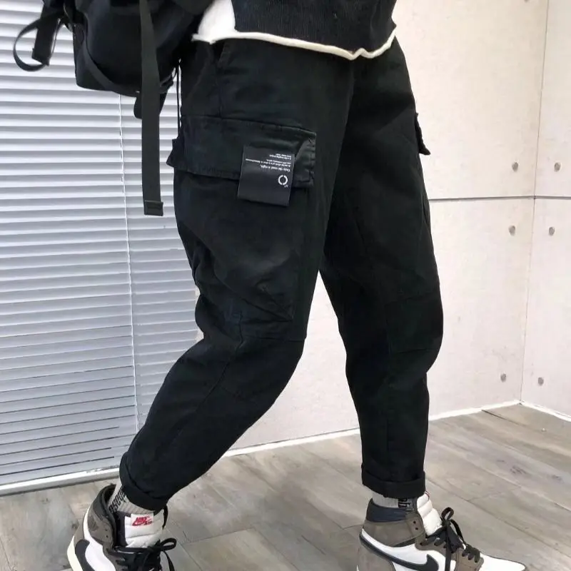 

Удобные мужские рабочие брюки на весну-осень, свободного кроя, с эластичным поясом, зауженные к низу, длинные повседневные брюки с множеством карманов