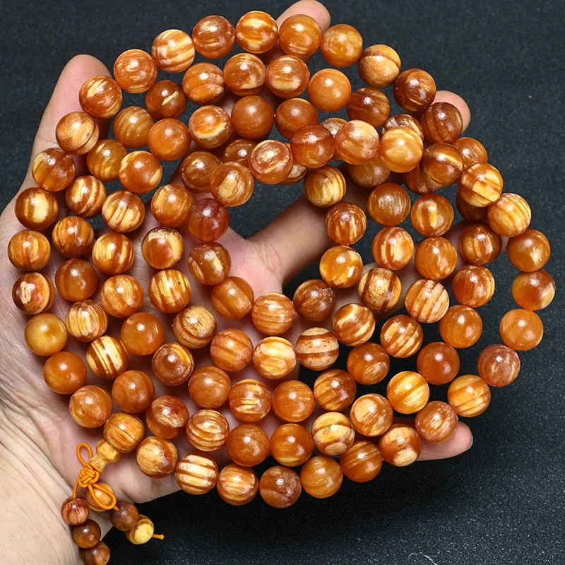 Authentic amber wood bracelet from the Northeast's Changbai Mountain, made of agarwood and translucent pine seeds, fully translu