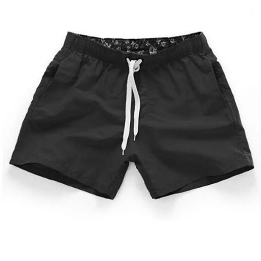 Solid color sports shorts for men\'s summer 2024 hot selling beach pants for loose and casual sports