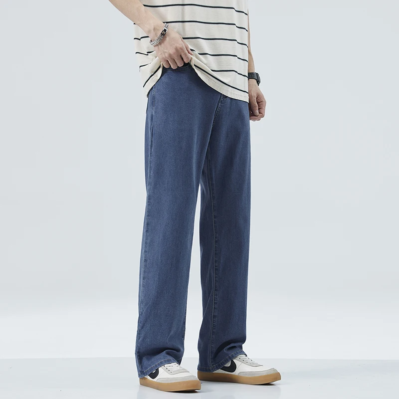 Уютные мягкие джинсы Lyocell из ткани для мужчин, летние тонкие эластичные дышащие свободные джинсовые брюки с широкими штанинами и эластичным поясом, повседневные брюки