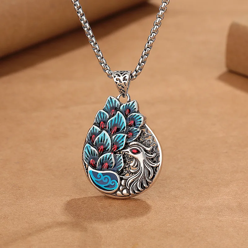 

Retro ethnic style phoenix peacock necklace, women's fashion creative enamel fired blue long sweater chain.